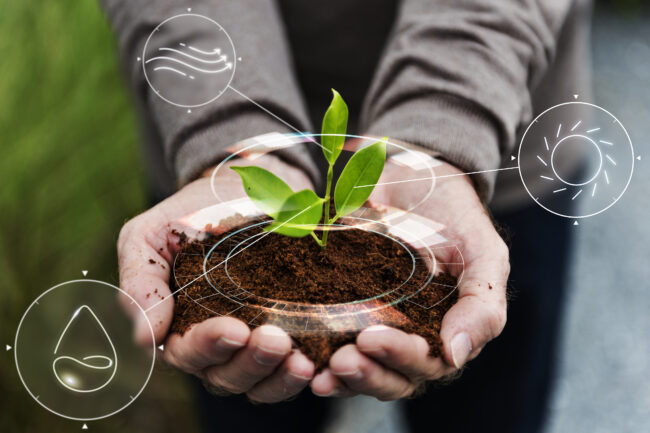 Smart agriculture IoT with hand planting tree background